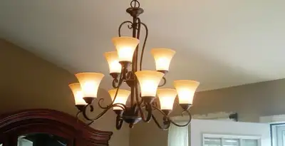 Classic ceiling chandelier installation with warm lighting in Glendale, AZ
