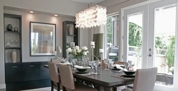 Elegant dining room chandelier installation above table in Glendale, AZ