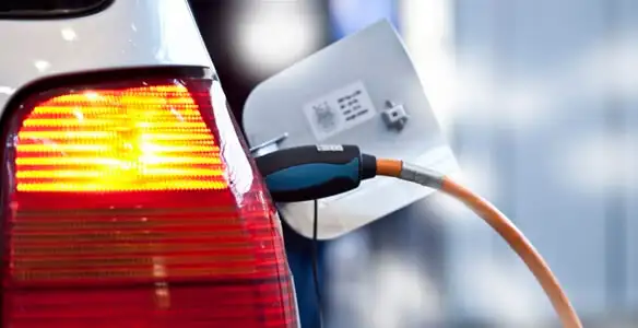 Electric car plugged into EV charger after professional installation in Glendale, AZ