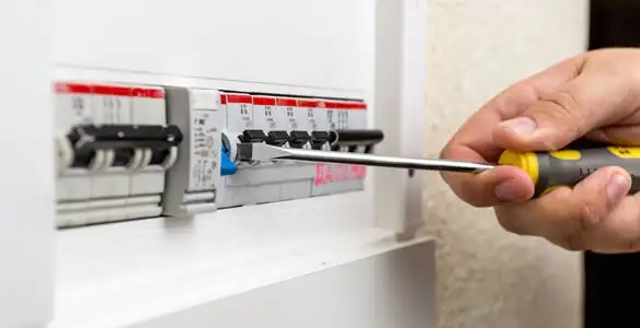 electrical panel upgrade service showing technician adjusting circuit breakers during system upgrade in Glendale, AZ