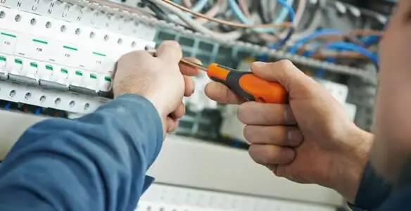 electrical service showing licensed electrician performing electrical panel maintenance and adjustments in Glendale, AZ