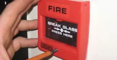 fire alarm installation service showing manual fire alarm pull station installed by licensed electricians in Glendale, AZ