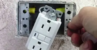 gfci circuits service showing installation of a ground fault circuit interrupter outlet by licensed electricians in Glendale, AZ