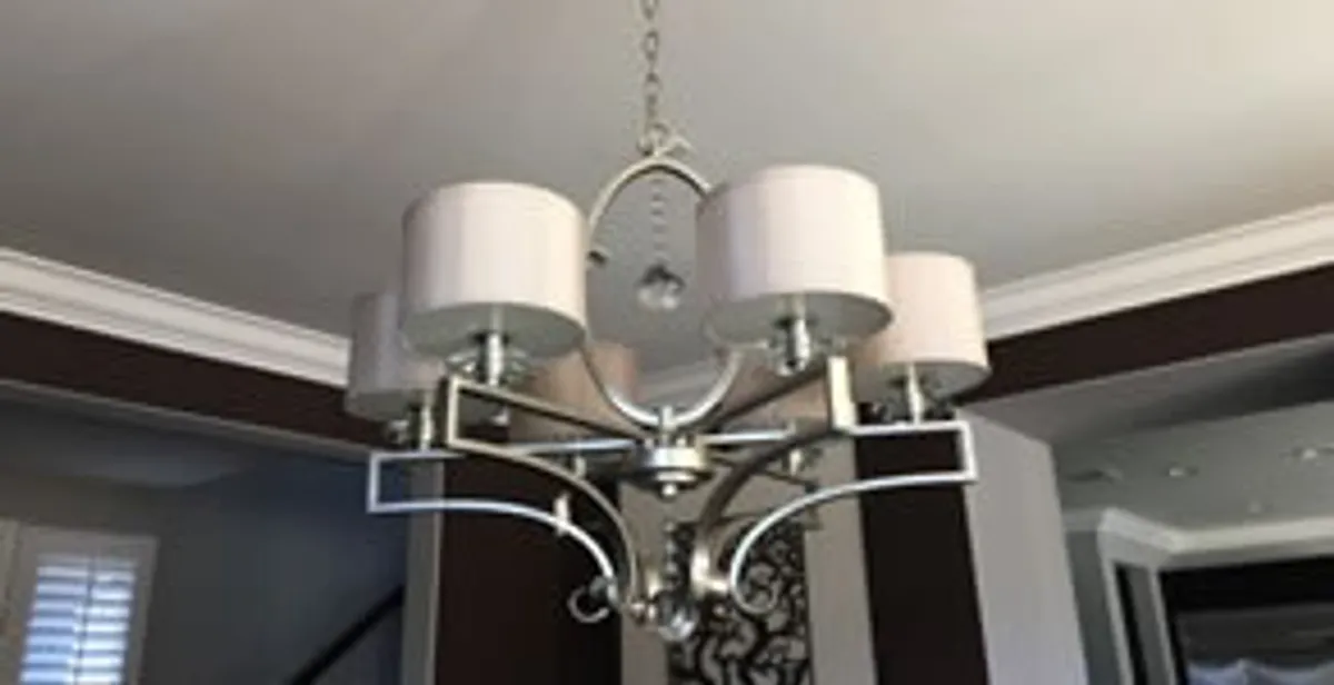 Modern chandelier installation with multiple light fixtures in Glendale, AZ