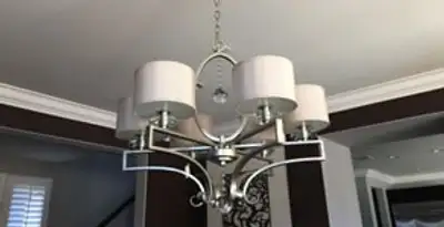 Modern chandelier installation with multiple light fixtures in Glendale, AZ