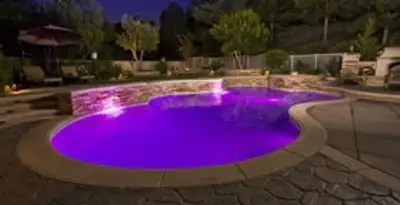 pool light installation and repair services illuminating a residential swimming pool in Glendale, AZ