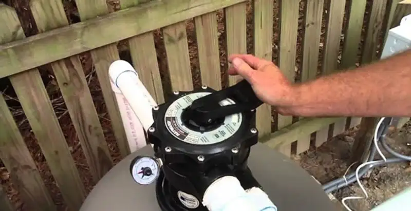 pool pumps service showing professional adjustment of pool pump control system in Glendale, AZ