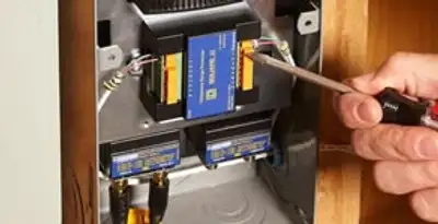 Whole home surge protection device being installed by a licensed electrician to protect electrical systems in Glendale, AZ